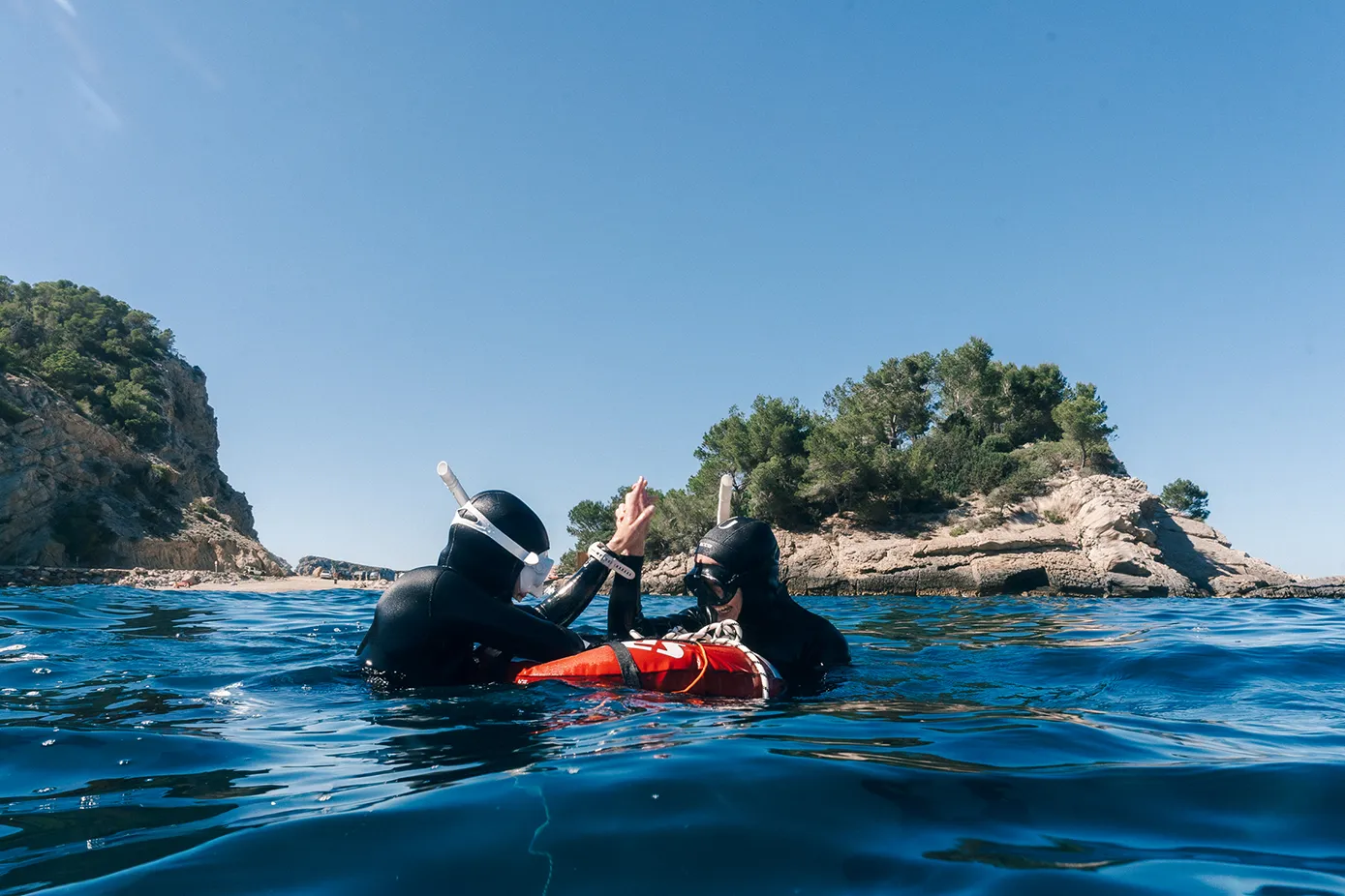 Freediving instructor teaching in the water